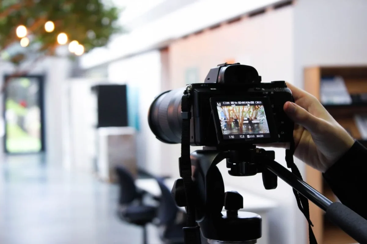 Essential real estate photography equipment for beginners including camera, wide-angle lens, and tripod